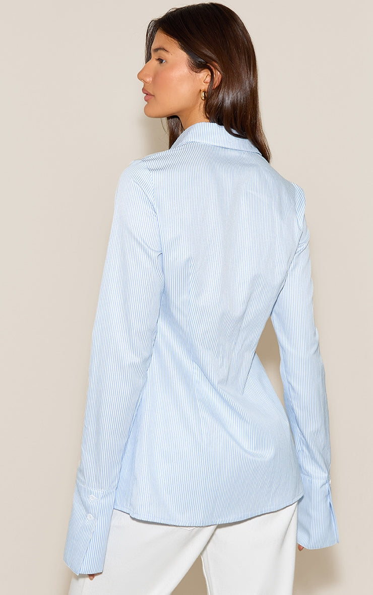 https://cdn-img.prettylittlething.com/b/0/5/4/b05408430da9aa7a7ee1b3da633d670419670470_CNN4788_2_blue_stripe_cotton_fitted_shirt.jpg