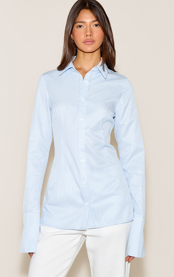 https://cdn-img.prettylittlething.com/f/1/2/b/f12bdadd1d4911d77de78db90adc065943a73fea_CNN4788_1_blue_stripe_cotton_fitted_shirt.jpg